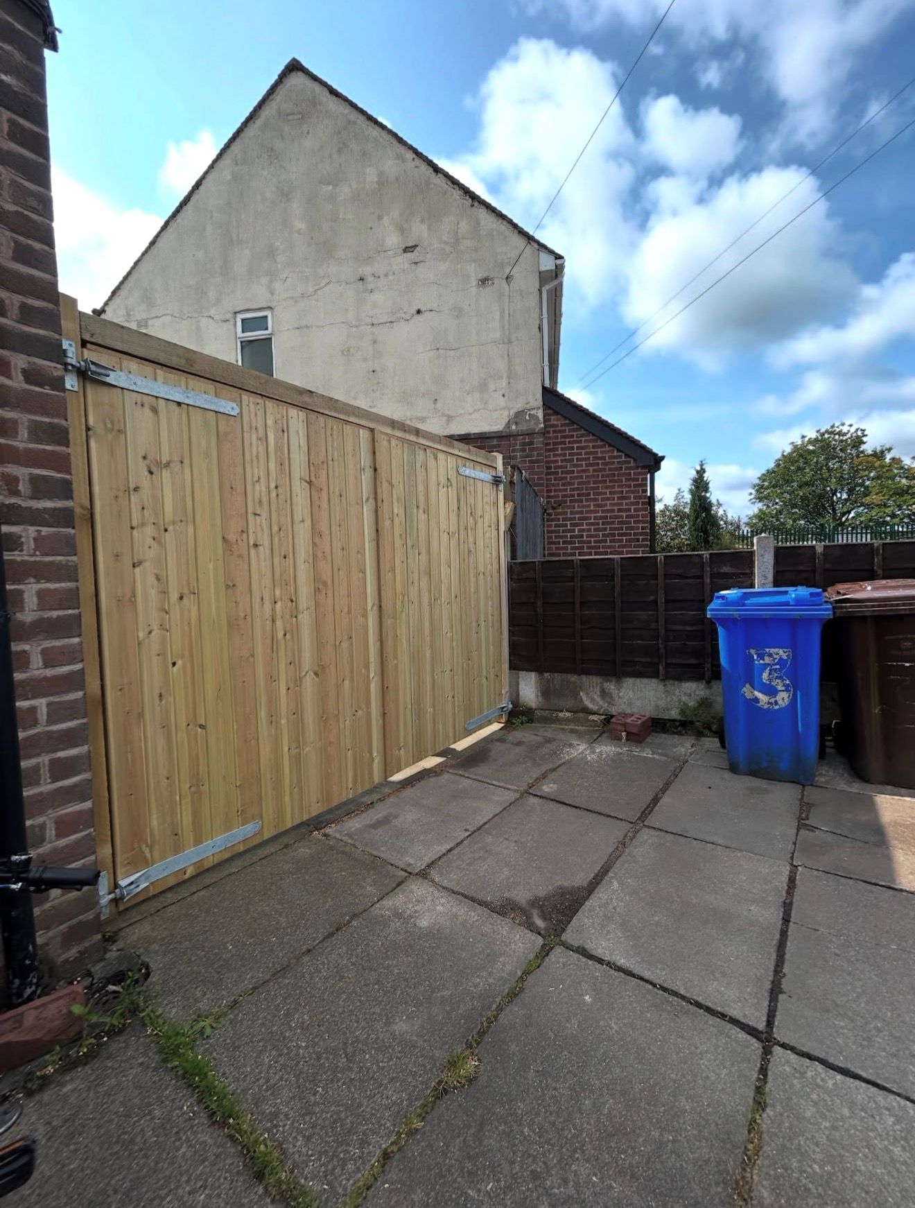 Bespoke timber double driveway gates installed at a residential property