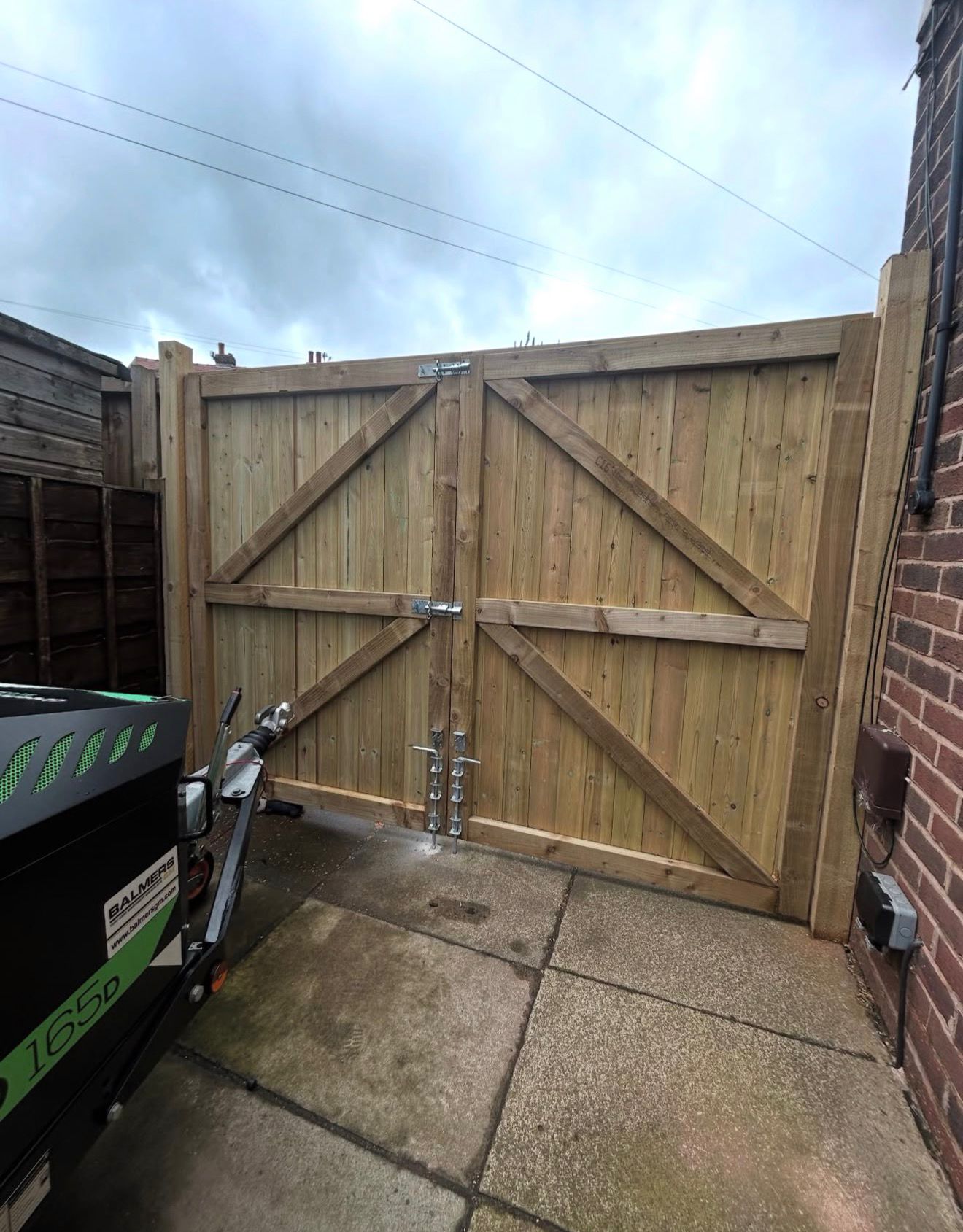 Hardwood double driveway gates with stone gateposts