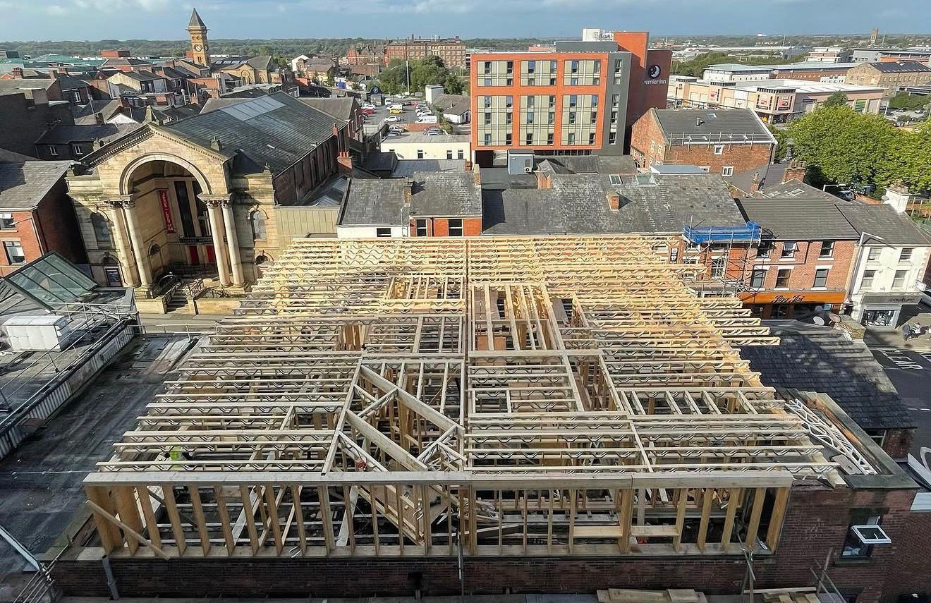Timber-framed roof extension structural carpentry in progress