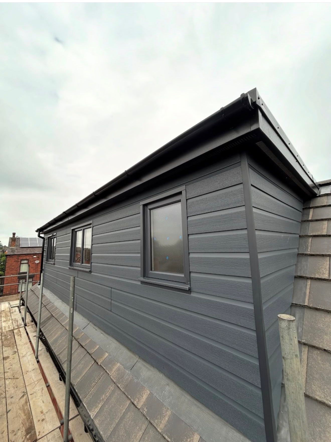 Finished grey-clad rear dormer loft conversion in Westhoughton