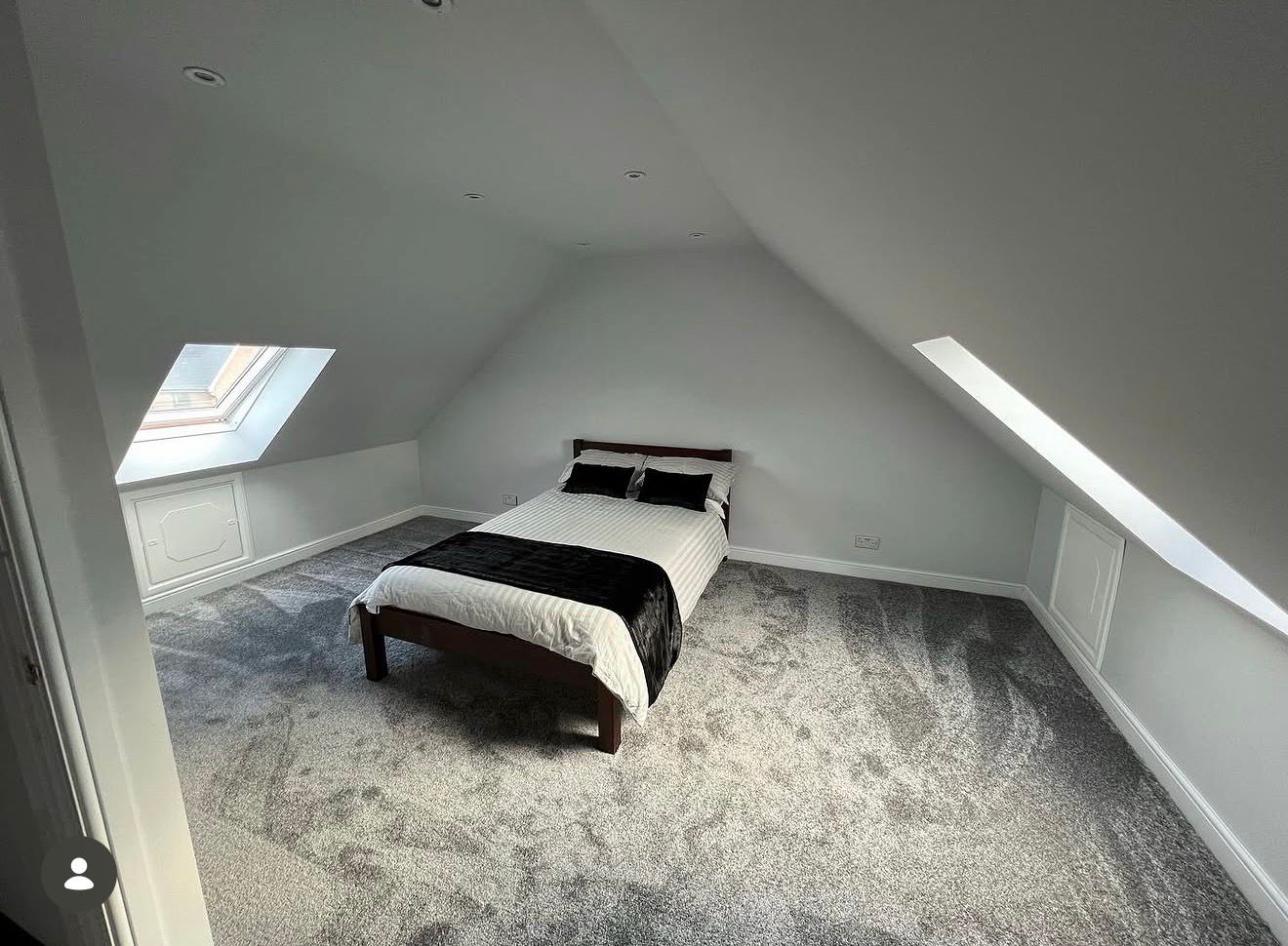 Master bedroom loft conversion in Rochdale — original trussed roof structure